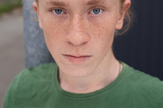 Portrait of young man with freckles
