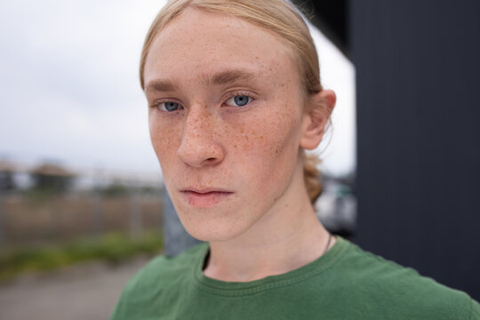 Portrait of young man with freckles