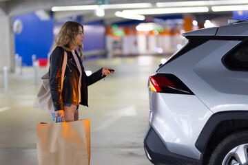 Woman opens car trunk