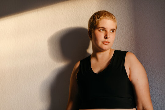 Non binary model in black binder bra