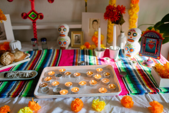 Candles on a tray in day of the dead altar