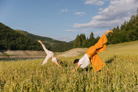 Women In Three Legged Dog Yoga Pose