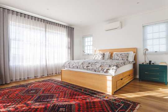 General View Of Luxury Bedroom With Bed, Carpet And Window