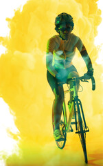African american female athlete wearing eyeglasses and helmet riding bike on smoky background