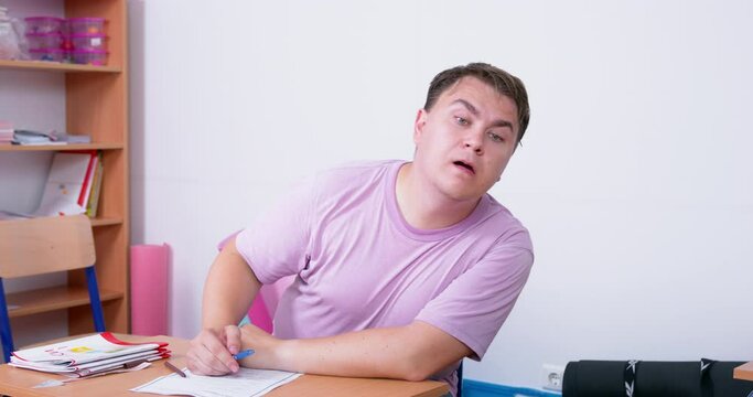 Stupid teaching sits i classroom at desk, peeps answers to test, cheats Meeting man no idea creative crisis spying jealous of others Copyright protection intellectual property steal idea plagiarism