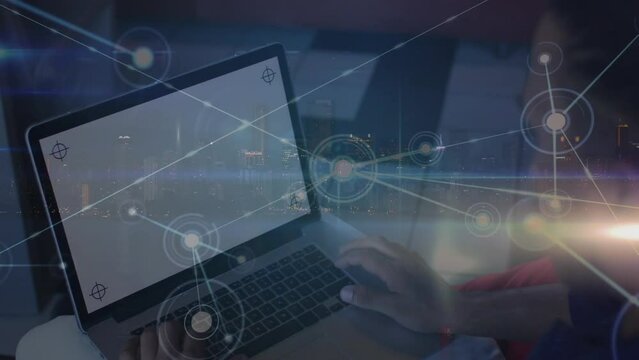 Animation of network of connections over biracial businessman using laptop with copy space