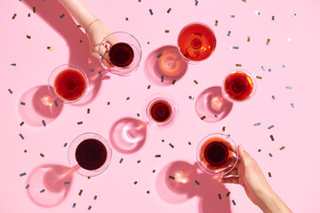 Bottle of rose sparkling wine or champagne with crystal wineglass