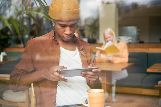 Man Working At Coffee Shop