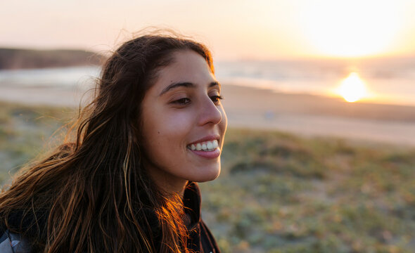 Smiling woman at sunset