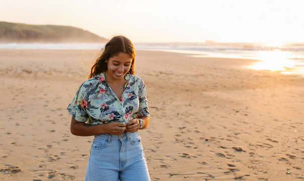 Smiling woman at sunset