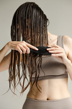 Combing wet hair. Beauty hair everyday routine 