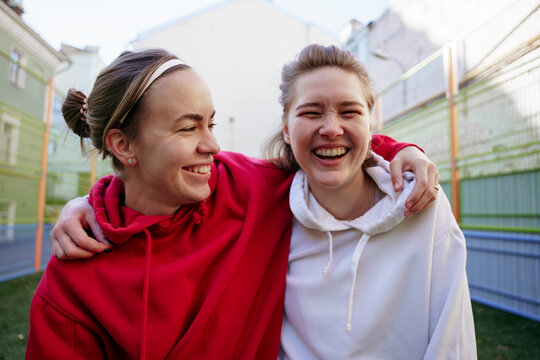 Portrait of two female soccer players on a sports field