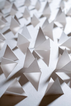 Triangular shapes cut from plain paper