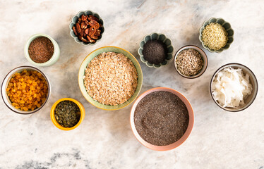 Healthy raw breakfast ingredients - nuts, seeds and dried fruits