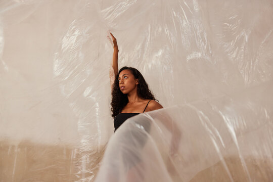 Young woman wrapping in film