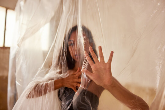 Young woman wrapping in film