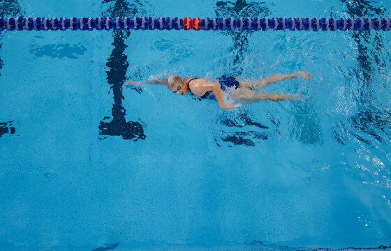 Swimmer from above in lap pool.