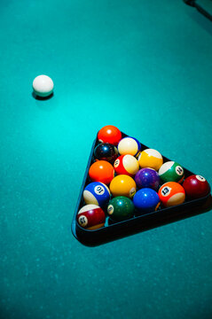 Balls in rack on pool table in club