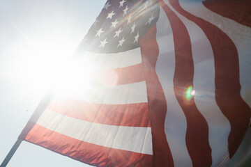 Sunflare with American flag in summer sunshine