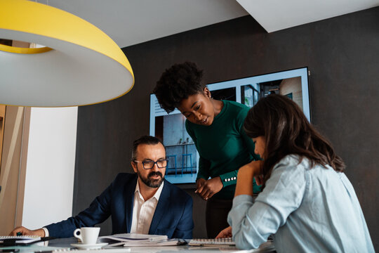 Colleagues Discussing Business In The Meeting Room