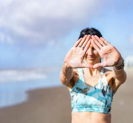 Cropped shot of an unrecognizable woman doing Triangle mudra