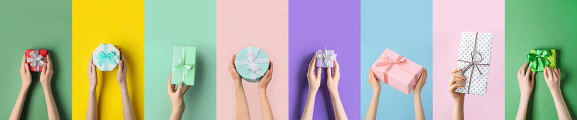 Many hands with beautiful gift boxes on color background