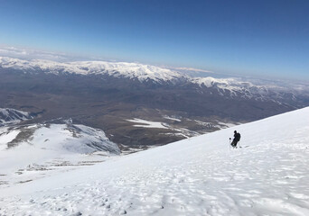 Mountaineer going down on Mount Eznevit at Aladaglar Mountain Range in Nigde, Turkey. Aladaglar is most important mountain range in Turkey.