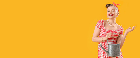Young pin-up woman with watering can on yellow background with space for text