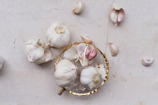 Bunch of raw garlic on marble background