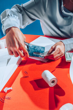 Clerk using staple gun