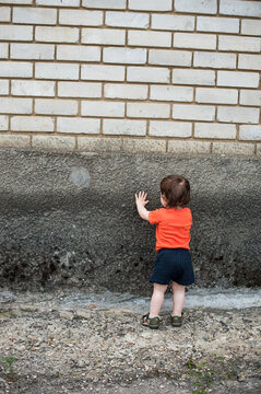 Little boy in an orange t-shirt