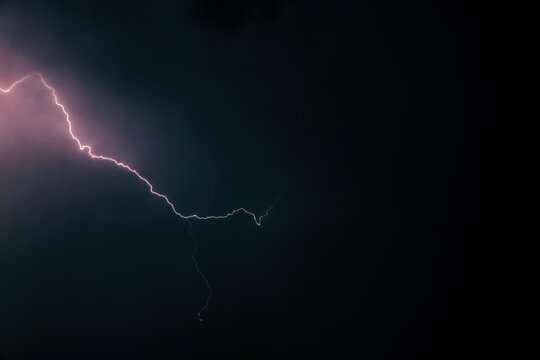 Lightning Bolt Across Stormy Night Sky