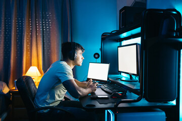 Gamer playing multi-screen video games online