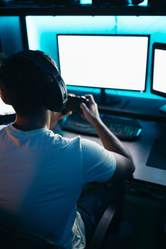 Gamer playing video games on multi-screen
