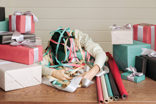 Gift wrapper lies on the table after a hard day's work