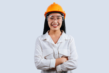 Young female engineer wearing yellow helmet stand with charming smile posture