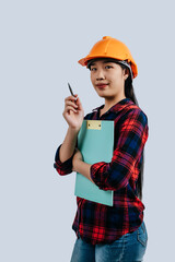 Young female engineer wearing Yellow helmet and clipboard