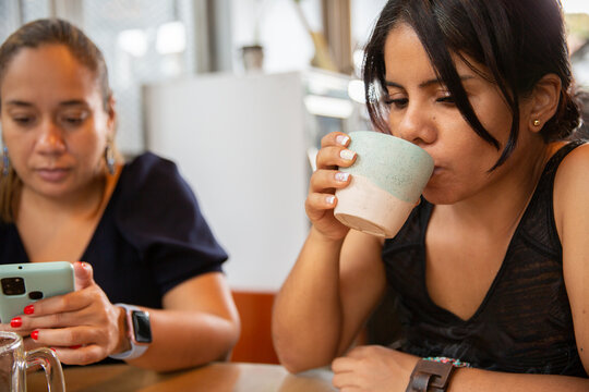 Two friends in a cafeteria