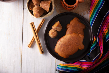 Puerquitos de Piloncillo. Traditional Mexican sweet bread with pig shape appearance, Usually eaten with coffee or hot chocolate at breakfast or as an afternoon snack.