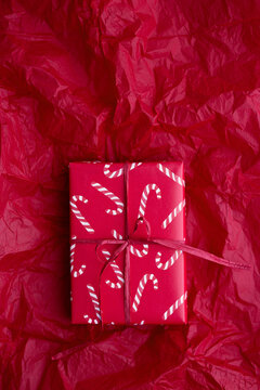 Christmas present wrapped with candy cane giftwrap