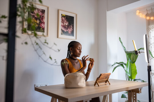 African American beauty blogger trying cream