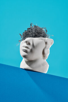 a used wire sponge in a white head