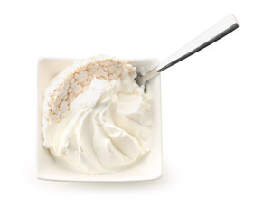 Bowl of delicious cream cheese on white background