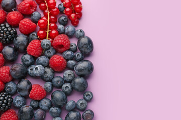 Heap of fresh ripe berries on color background