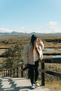 Female photographer enjoying scenery, rural nature 