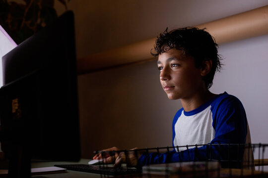 teen boy studying at night