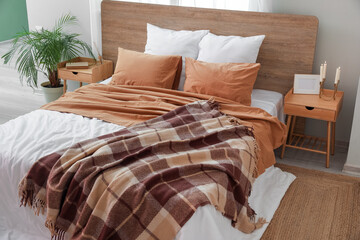 Fototapeta na wymiar Interior of stylish bedroom with wooden tables