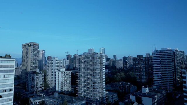 English Bay Vancouver from the beach to the modern newly built condos along denman and davie area on a sunny clear day