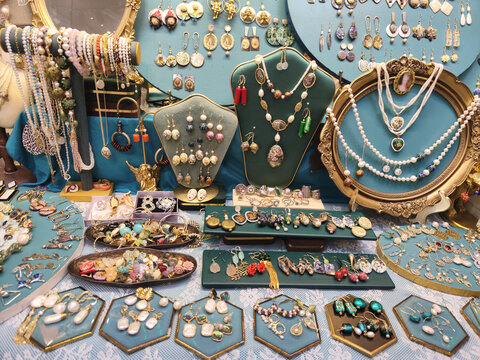 vintage jewelry are displayed and sold at street stall, in Guang