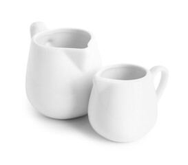 Ceramic milk jugs isolated on white background